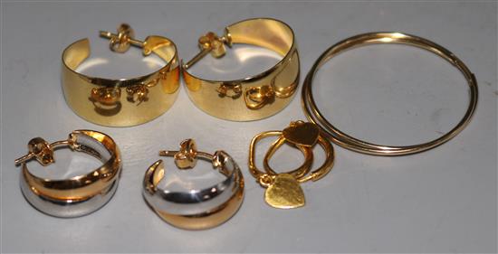 Three pairs of 14ct gold earrings and a pair of yellow metal heart shaped drop earrings.